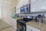Granite countertops and stainless steel gourmet kitchen